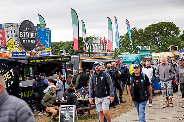 Motorsports fans wandering around the Fan Park during the Isle of Man's TT Fortnight