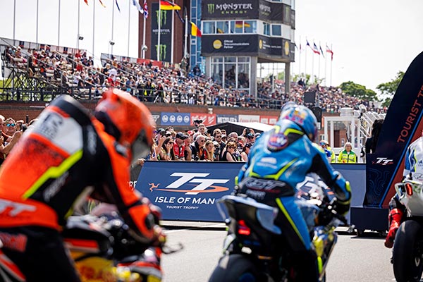 Motorbikes at the TT start line overlooked by the grandstand