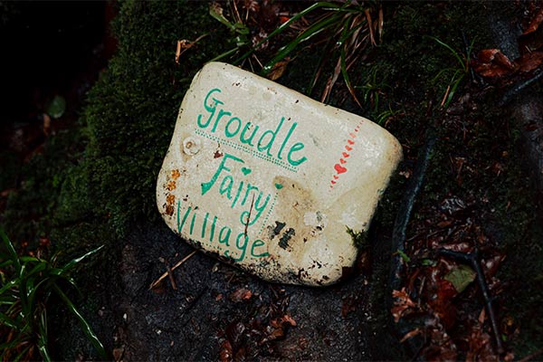 A plaque reading Groudle Glen Fairy Village