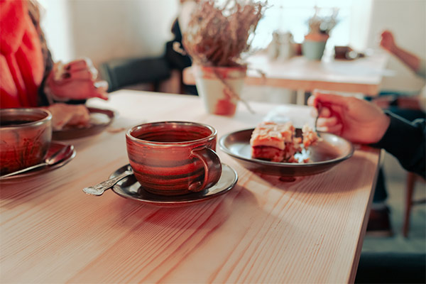 Coffee and cakes on a table at Noa Bakehouse on the Isle of Man