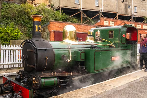 A vintage green steam train on the Isle of Man