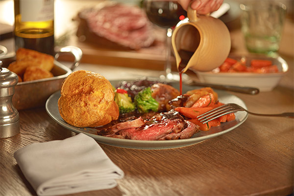 Gravy pouring on a Sunday roast