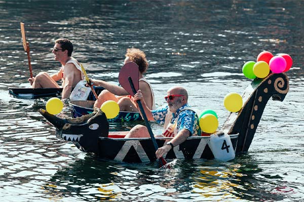 People in the sea in bathtubs at the World Tin Bath Championships on the Isle of Man